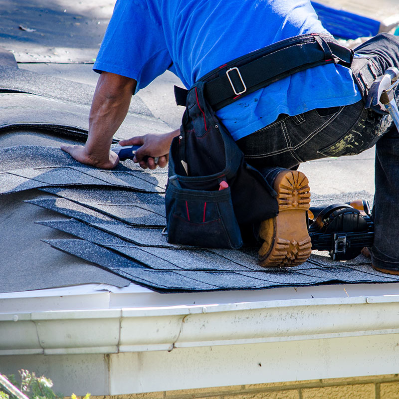 roofer-installing-asphalt-shingles-for-house-springfield-va